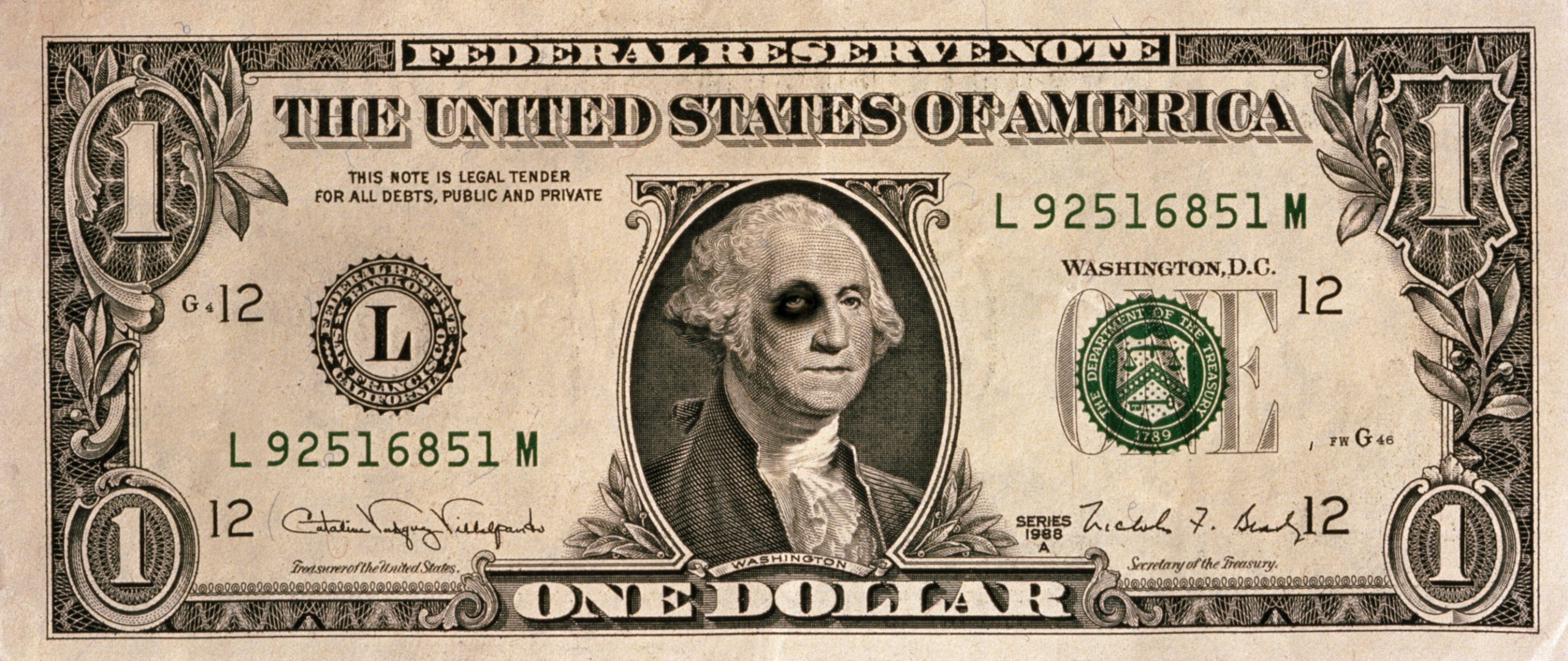 US one dollar banknote, George Washington with black eye.