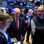 Trading Day: Teflon stocks glide higher