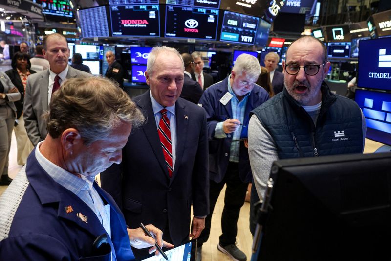 Trading Day: Teflon stocks glide higher