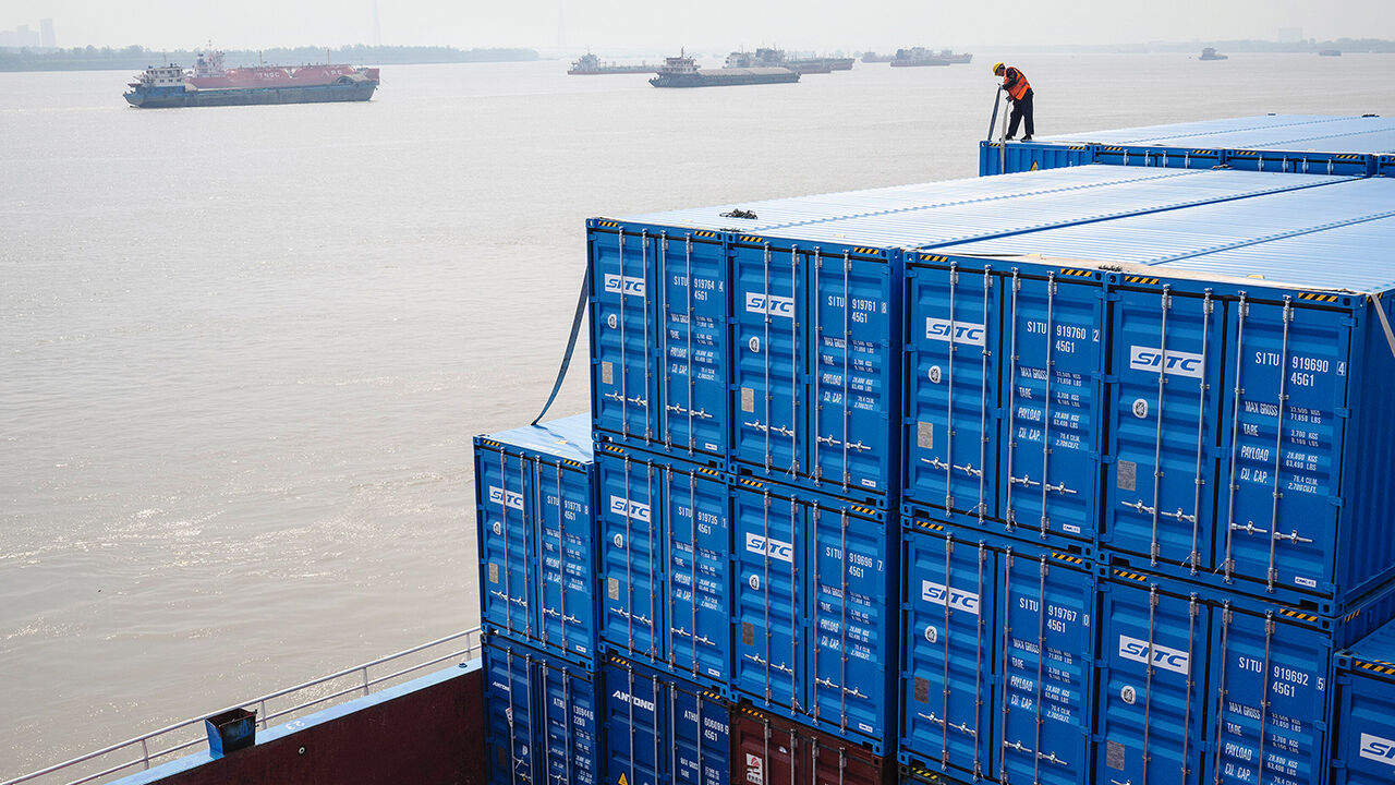 A barge loaded with containers at Yangluo Port on the Yangtze River, in Wuhan, China.