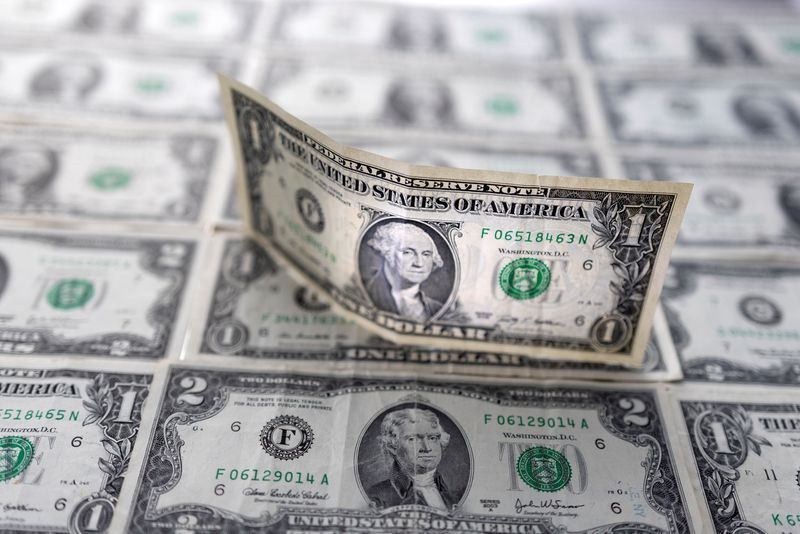 Dollar loses ground against peers after Fed cuts rates